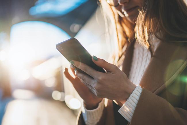 woman holding phone